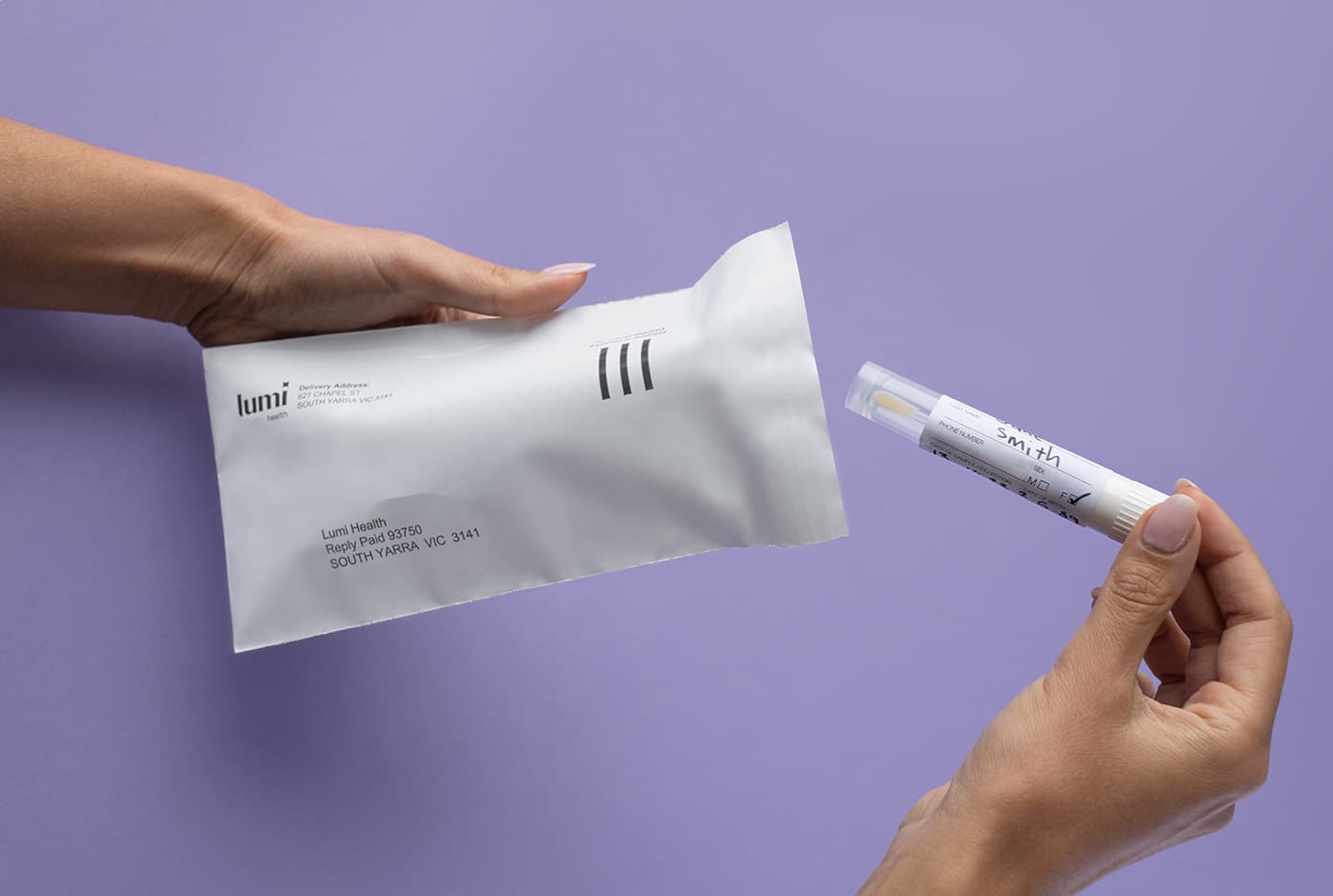 putting a Lumi swab into an envelope