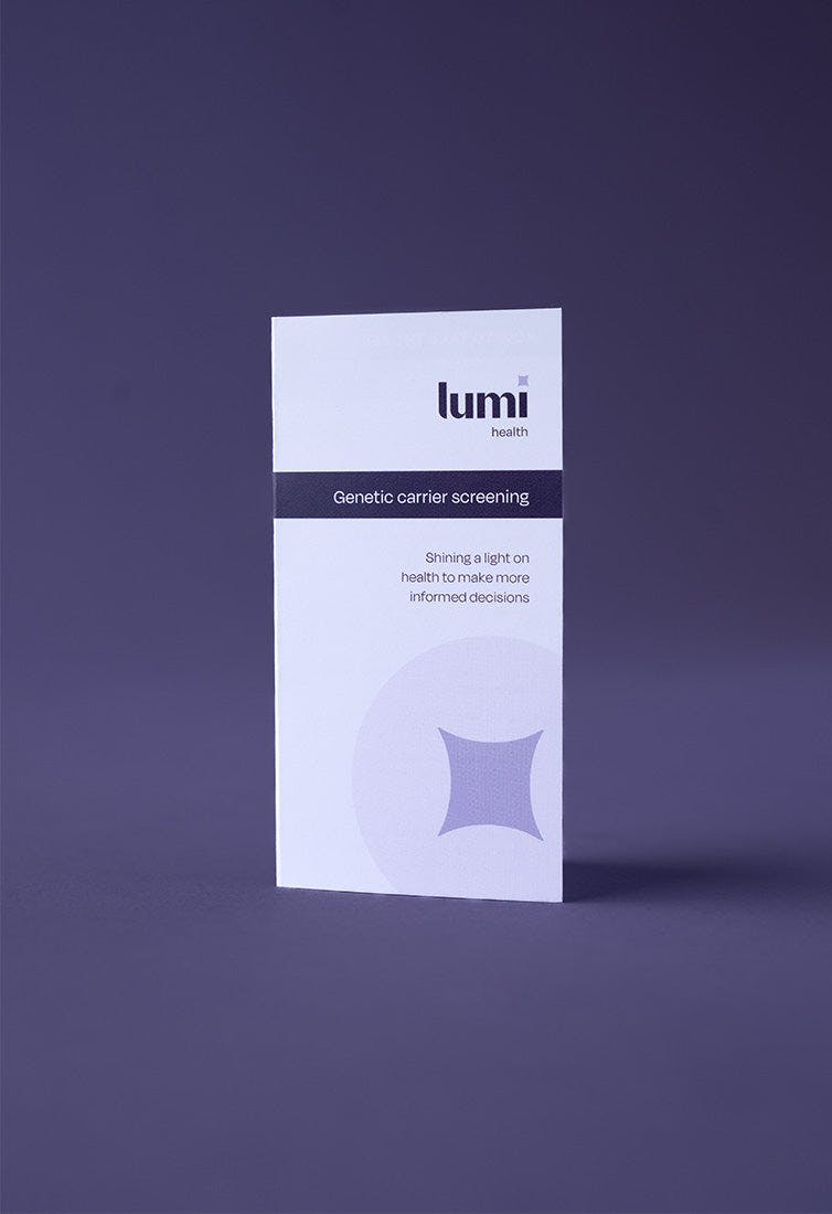 A photo of the instruction booklet included with a Lumi Health Comprehensive Carrier Screening test