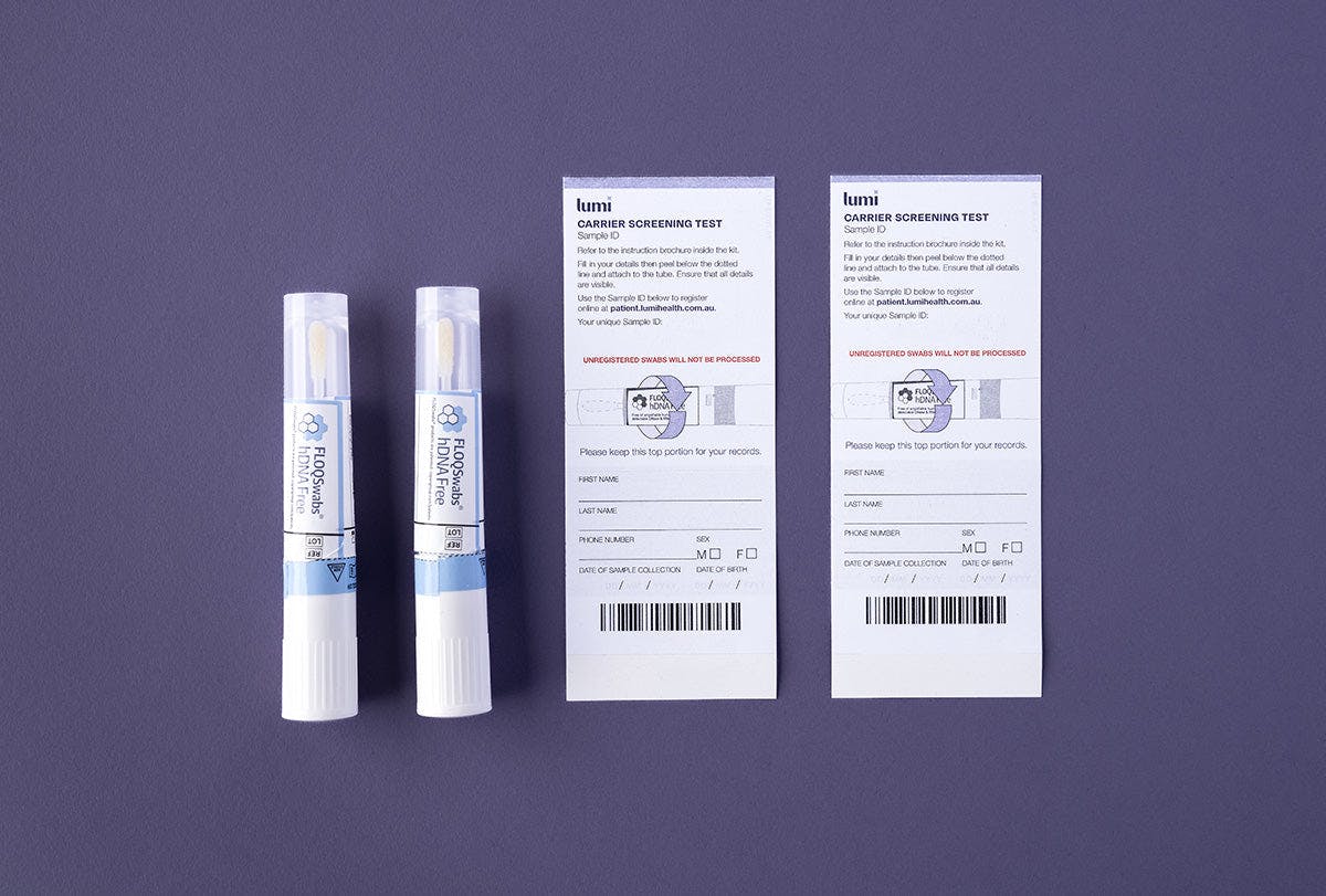 A photo of the 2 swabs and Sample ID stickers included in a Lumi Health Comprehensive Carrier Screening test