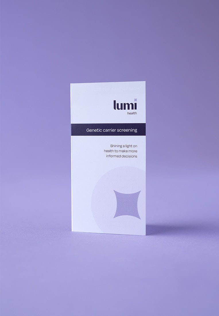 A photo of the instruction booklet included with a Lumi Health Extended Carrier Screening test