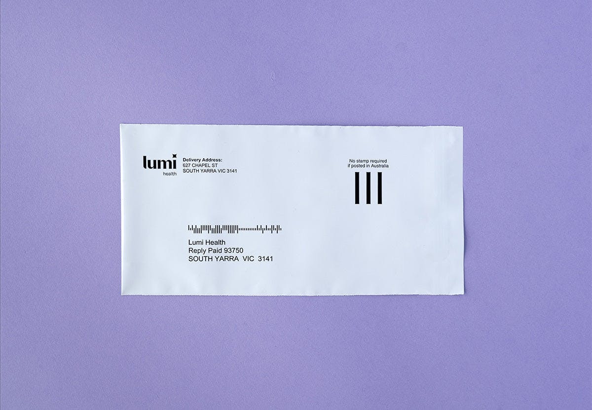A photo of a Lumi Health reply-paid envelope