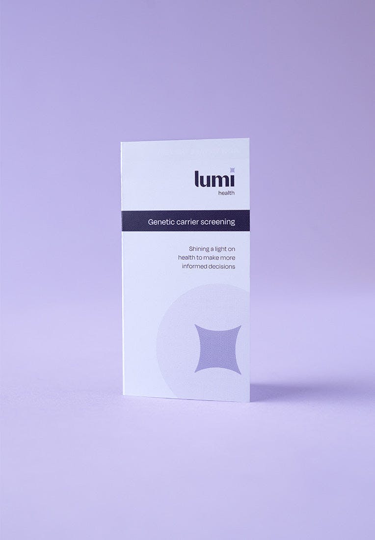 A photo of the instruction booklet included with a Lumi Health Standard Carrier Screening test