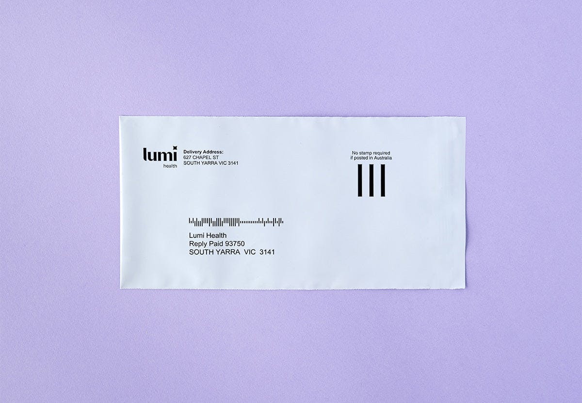 A photo of a Lumi Health reply-paid envelope